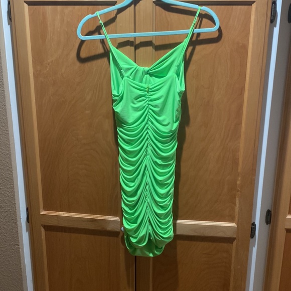 fluorescent green spaghetti strap mini dress. 96% Polyester 4% spandex. - Picture 2 of 2